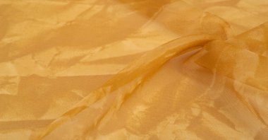 Sarı ipek kumaş dokusu. Tasarımınız, giysileriniz ve posterleriniz için de mükemmel. Güzel proje aksanlarıyla yaratıcı ol..