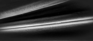 doku, arka plan, desen. Siyah ipek kumaş. Siyah ve ısıya gri ile dayanıklıdır. Herhangi bir olay için bir tasarım içine sert perde dönüştürün. Bu gevrek, hafif dokulu el.