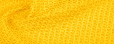Arka plan dokusu, desen. Metalik pullu sarı kumaş. Bu güzel, hafif pullu kumaşın notaları, pullu aksanı ve güzel bir tasarımı var. Ayrıca güzel bir parıltısı var..