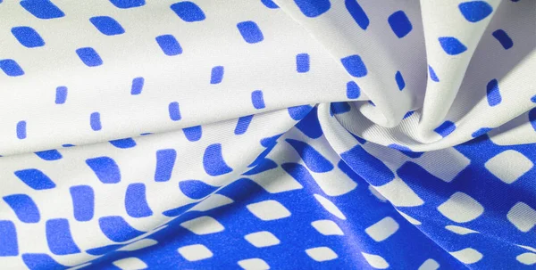 texture background pattern. silk fabric with a pattern of blue squares on a white background. This is a heavy square 100% polyester pattern that fits perfectly with modern, transitional or contemporary design.