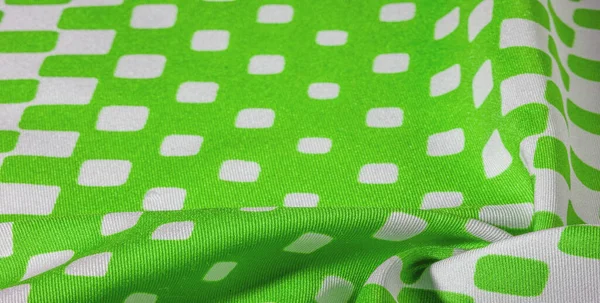 texture background pattern. Silk fabric with a pattern of green squares on a white background. This is a heavy square 100% polyester pattern that fits perfectly with modern, transitional or contemporary design.
