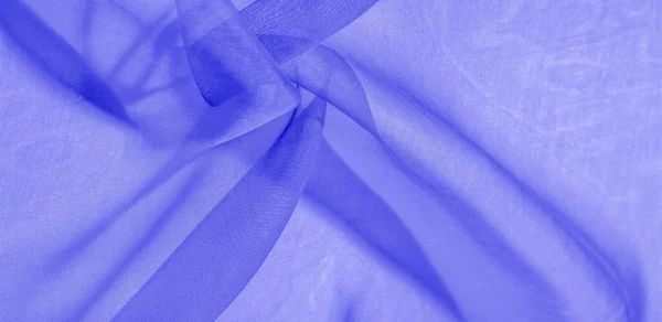 Texture of blue silk fabric. It is also perfect for your design, clothes, posters. Be creative with beautiful project accents. This fabric is inspired by your inspiration.