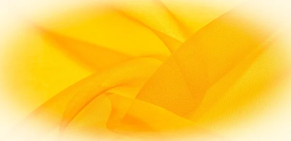 Texture of yellow silk fabric. It is also perfect for your design, clothes, posters. Be creative with beautiful project accents. This fabric is inspired by your inspiration.