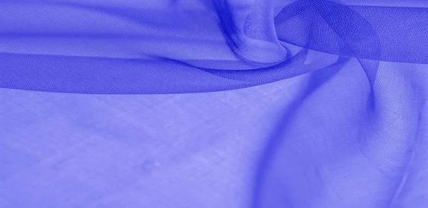 Texture of blue silk fabric. It is also perfect for your design, clothes, posters. Be creative with beautiful project accents. This fabric is inspired by your inspiration.