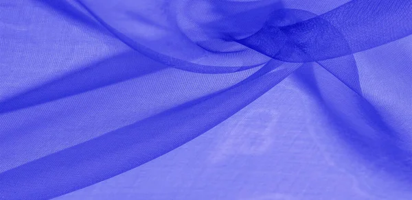 Texture of blue silk fabric. It is also perfect for your design, clothes, posters. Be creative with beautiful project accents. This fabric is inspired by your inspiration.