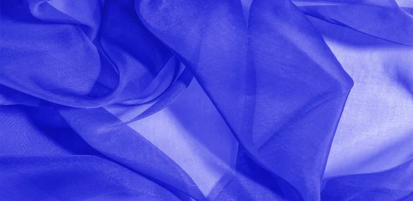 Texture of blue silk fabric. It is also perfect for your design, clothes, posters. Be creative with beautiful project accents. This fabric is inspired by your inspiration.