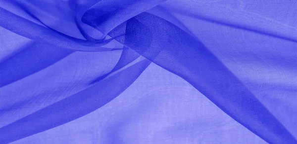 Texture of blue silk fabric. It is also perfect for your design, clothes, posters. Be creative with beautiful project accents. This fabric is inspired by your inspiration.