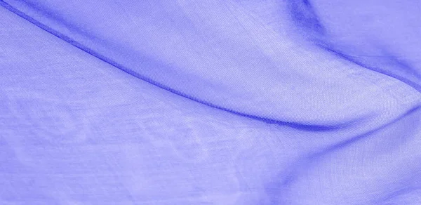 Texture of blue silk fabric. It is also perfect for your design, clothes, posters. Be creative with beautiful project accents. This fabric is inspired by your inspiration.