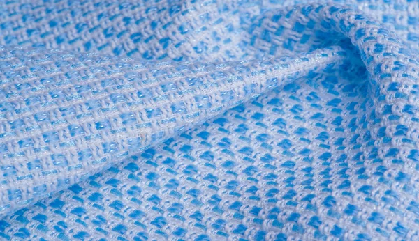 Texture, fabric, pattern. Large weave of blue and white threads, tightly woven fabric with a very simple over-under weave and very little sheen, which makes it nice and professional.