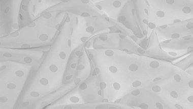 Dokulu arka plan, siyah ve beyaz polka nokta ipek kumaş. Bu çok yönlü kumaş şık tasarım projeleri oluşturmak için idealdir. Renkler gri ve beyaz içerir.