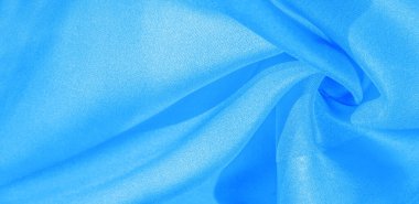 Doku, arkaplan, desen, mavi ipekten kumaş. Bu ipek inanılmaz derecede zarif. Bundan elde edilen projeler uzun süre devam edecek ve hala oldukça iyi durumda olacak..