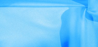 Doku, arkaplan, desen, mavi ipekten kumaş. Bu ipek inanılmaz derecede zarif. Bundan elde edilen projeler uzun süre devam edecek ve hala oldukça iyi durumda olacak..