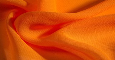 arka plan, desen, doku, Turuncu ipek kumaş parlak bir parlaklık vardır. Bu draping yumuşak kıvrımlar içine katlanır ve en çok yönlü kumaştır. Tasarımınızın güzel vurgularıyla yaratıcı olun.
