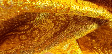 Doku arka planı, desen. Kumaş, sarı altın işlemeli kumaş. Organza brokar kumaş. Çoban, gevrek palmiyeli. Geniş iplik boyalı bir çiçek deseni var..