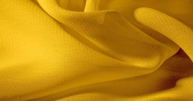 Arka plan, desen, doku, duvar kağıdı, sarı soluk ipek kumaş parlak bir parlaklık vardır. Bu en çok yönlü kumaştır. Tasarımınızın güzel vurgularıyla yaratıcı olun.