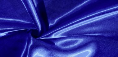 Doku, arkaplan, desen, mavi ipekten kumaş. Bu sevimli, yumuşak ve parlak kumaşın pürüzsüz bir vizon yüzeyi var. Projelerinizi yaratmak için mükemmel..
