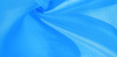 Doku, arkaplan, desen, mavi ipekten kumaş. Bu ipek inanılmaz derecede zarif. Bundan elde edilen projeler uzun süre devam edecek ve hala oldukça iyi durumda olacak..