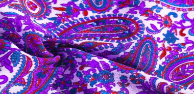 Arka plan dokusu, desen, desenli kumaş pamuk. Özgür Ruh için Kaffe Fassett tarafından tasarlanan bu büyük desenli paletin renk tonları, sıcak pembe, kobalt mavisi, fuşya ve mor ile yeşilin tonlarıdır..