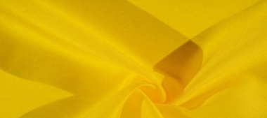 Doku arka plan deseni, sarı kumaş ipek. Krep saten arka tasarım için mükemmel bir kumaş, bir yandan bir saten bitirmek ve diğer - krep, hangi geri dönüşümlü hale getirir