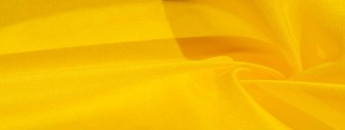 Doku arka plan deseni, sarı kumaş ipek. Krep saten arka tasarım için mükemmel bir kumaş, bir yandan bir saten bitirmek ve diğer - krep, hangi geri dönüşümlü hale getirir