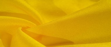 Doku arka plan deseni, sarı kumaş ipek. Krep saten arka tasarım için mükemmel bir kumaş, bir yandan bir saten bitirmek ve diğer - krep, hangi geri dönüşümlü hale getirir