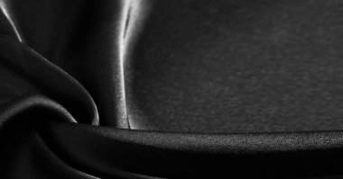 Arkaplan, desen, doku, duvar kağıdı, siyah ipek kumaş. Herhangi bir tasarıma biraz lüks katarak, bu aşırı yumuşak ve hafif polyester astarlı kumaşa yerleştirin..