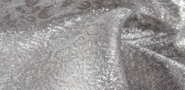 Doku arka planı, desen. Beyaz ipek kumaş. Organza brokar kumaş. Çoban, gevrek palmiyeli. Geniş iplik boyalı bir çiçek deseni var..