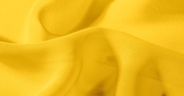 Arka plan, desen, doku, duvar kağıdı, sarı soluk ipek kumaş parlak bir parlaklık vardır. Bu en çok yönlü kumaştır. Tasarımınızın güzel vurgularıyla yaratıcı olun.