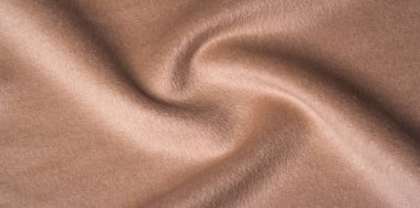 Kalıp, doku, arka plan, sıcak yün bej kumaş. Bu klasik yün ipliği projeleriniz, tasarım ve duvar kağıtlarınız için mükemmel. Klasik ipliğin arzu edildiği diğer tüm dilekler.