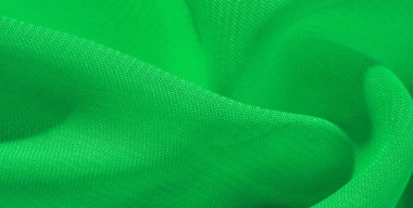 doku arka plan desen yeşil ipek kumaş. Bu ipek organze nazik bir açık diş vardır. Bu lüks kumaşı, özel günler için tasarımınızdan projelerinizi oluşturmaya kadar her şey için kullanın.