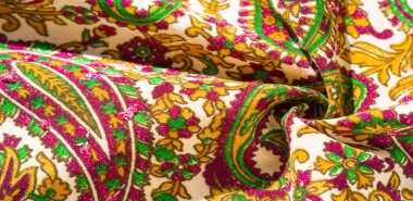 Arka plan dokusu, desen, desenli kumaş pamuk. Özgür Ruh için Kaffe Fassett tarafından tasarlanan bu büyük desenli paletin renk tonları, sıcak pembe, kobalt mavisi, fuşya ve mor ile yeşilin tonlarıdır..