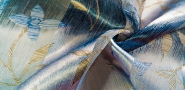 desen, şekil, arka plan. Bu güzel kumaş metalik gümüş kayganlaştırıcı ile süslenmiş soyut bir deseni var, bu da büyük bir görsel ilgi uyandırıyor. Tasarımlarınıza zarafet eklemek için ideal