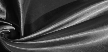 Doku, arkaplan, desen, siyah ipekten kumaş. Bu sevimli, yumuşak ve parlak kumaşın pürüzsüz bir vizon yüzeyi var. Projelerinizi yaratmak için mükemmel..