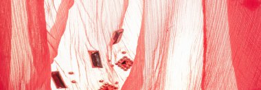 Arkaplan tasarımı dokusu, ipek desen, pembe kumaş ve dekoratif işlemeli taşlar.