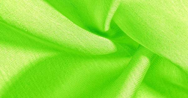绿色丝绸面料 它有一个光滑的哑光光洁度 使用这种豪华的面料任何东西 从设计到你的项目 可能性是无穷无尽的 — 图库照片