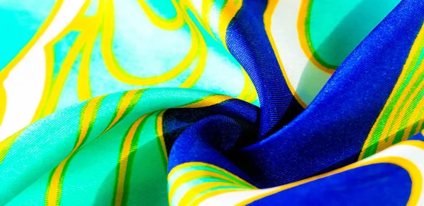 silk abstract fabric. This luxurious silk chiffon fabric is a show-stopper. It is transparent has a liquid drape and is very soft. Ideal for your projects. Colors include green yellow white and blue