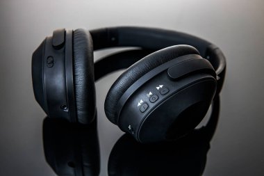 Recording studio headphones on a black and gray gradient background
