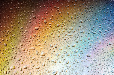 Abstract drops on a rainbow, can be used as a background. Concept, abstract art