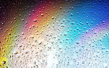 Abstract drops on a rainbow, can be used as a background. Concept, abstract art