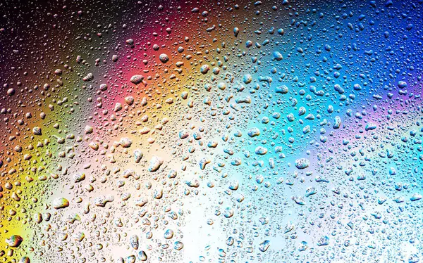 Abstract drops on a rainbow, can be used as a background. Concept, abstract art