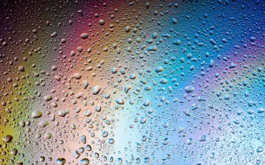 Abstract drops on a rainbow, can be used as a background. Concept, abstract art