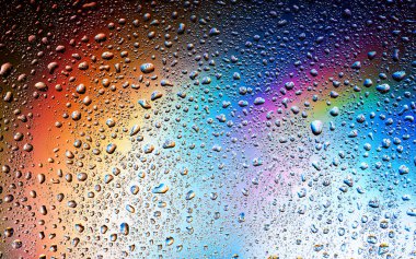 Abstract drops on a rainbow, can be used as a background. Concept, abstract art