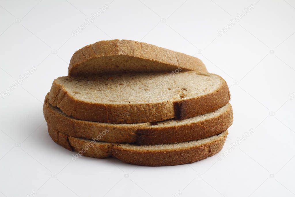 Isolate of white loaf of bread with sliced pieces on a white background