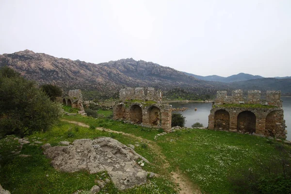 Ruined walls of castle over the lake Bafa in a nature reserve situated in southwestern Turkey