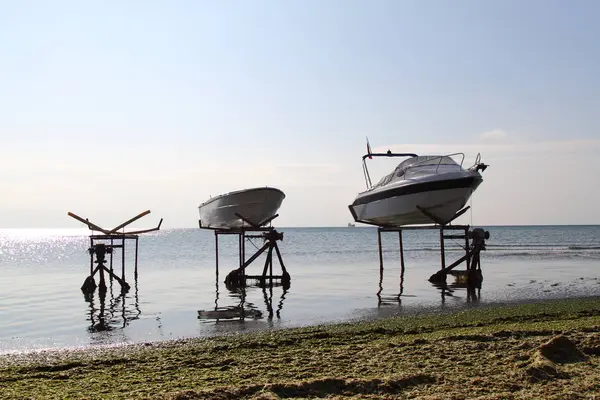 A couple of boats covered up and ready for winter