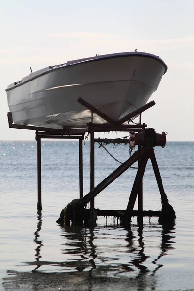 A couple of boats covered up and ready for winter