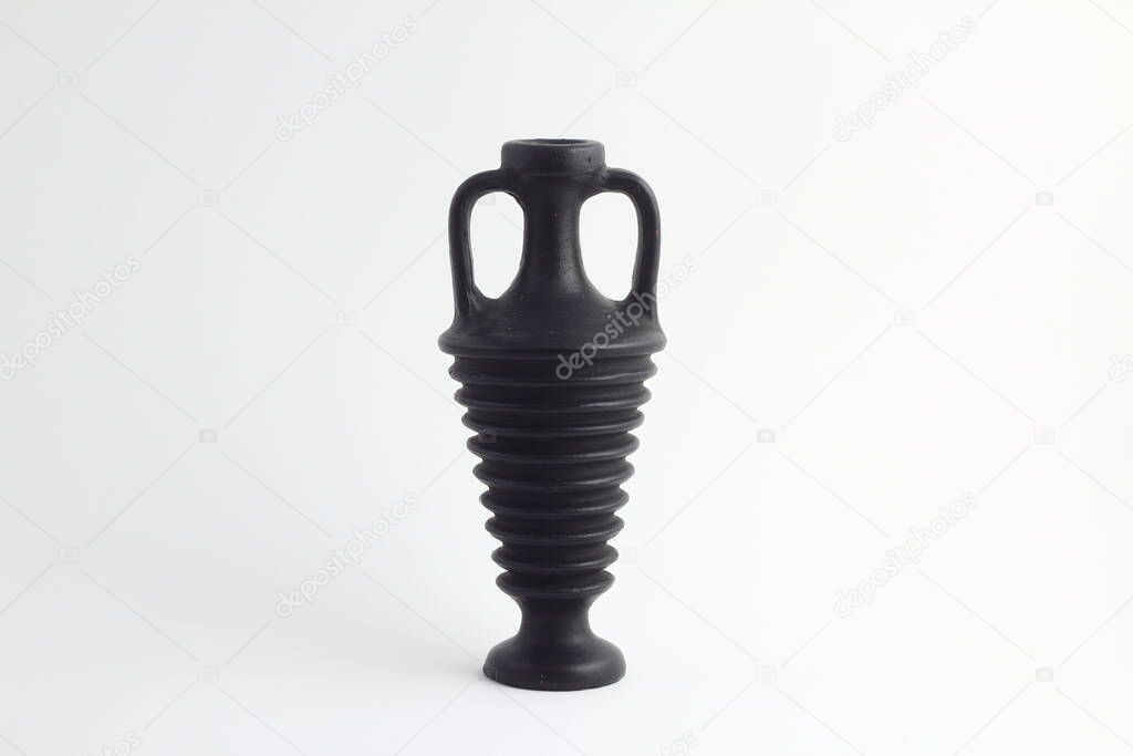 clay black jug isolated on a white background. vintage empty jug front view. vintage capacity