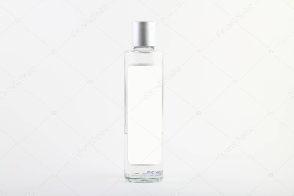 Bottle of cologne isolated over a white background.