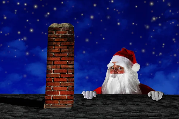 Santa claus op het dak — Stockfoto