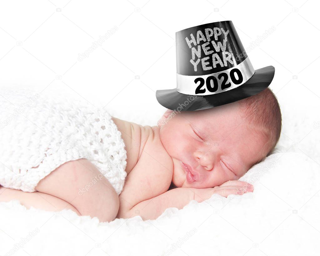 Portrait of a newborn baby wearing a Happy New Year tophat, 2020